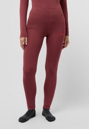 Leggings bordeaux en tissu côtelé avec une taille haute, arborant un petit logo sur le côté gauche. Texture lisse et design ajusté.