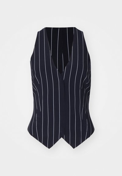 Navy vest with white vertical stripes, V-neck design, sleeveless, fitted shape, accentuated waist, and pointed hem. Soft, smooth fabric texture.