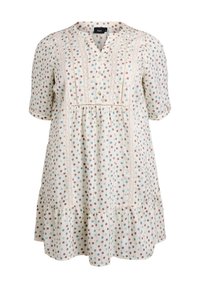 Vestido ligero de crema con mangas cortas, patrón de lunares en marrón y verde azulado, cuerpo plisado, detalles de encaje y dobladillo acampanado.