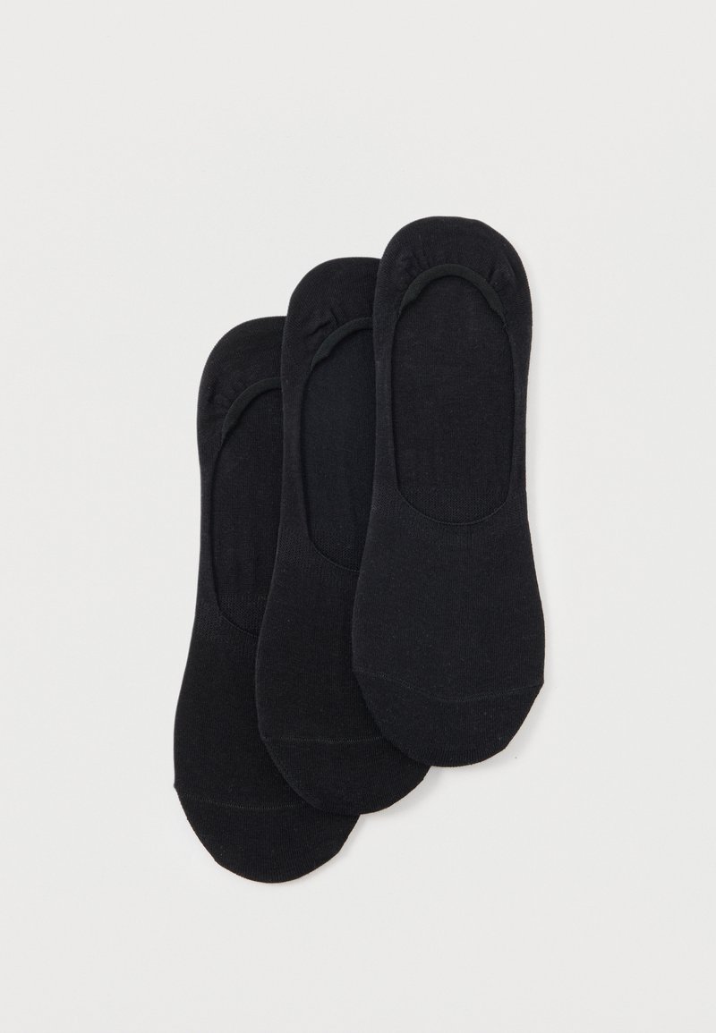 Trois paires de chaussettes noires basses invisibles disposées en chevauchement sur un fond blanc.