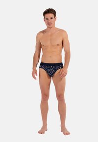 Herren Unterhose in Marineblau mit buntem Blumenmuster, elastischem Bund und glatter Textur. Entworfen für Komfort und eine figurbetonte Silhouette.