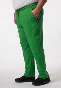 Groene sweatpants van een katoenmix, met een elastische tailleband met een trekkoord, zijzakken en een klein logo in bijpassende kleur.