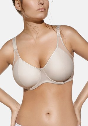 interior beige de mujer | Ropa íntima en