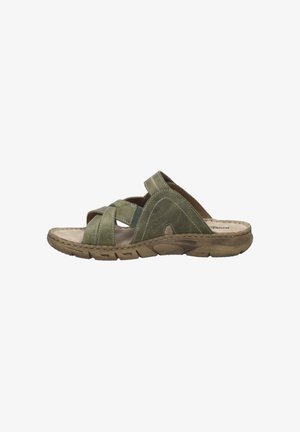 Green leather sandals with cross-strap design, cushioned insole, and textured rubber sole. Stitch detailing along the edges.
