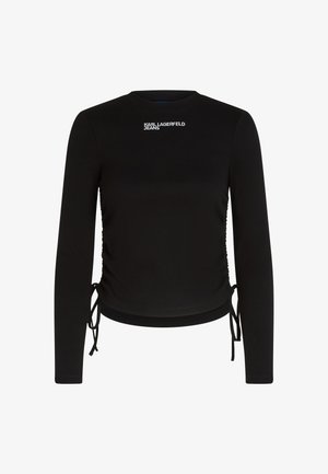 Fekete, hosszú ujjas felső, amely testhezálló dizájnnal, bordázott textúrával és oldalra húzható zsinórral rendelkezik. A "KARL LAGERFELD JEANS" logó fehér színben található az elülső részen.