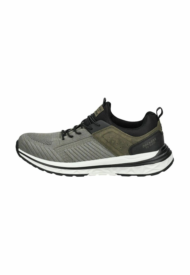 Graue Sportschuhe mit Obermaterial aus Mesh und Synthetik, schwarzen Akzenten, strukturierten Details und einer weißen Zwischensohle mit einem Gummilaufflächenmuster.