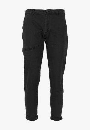 Pantalons noirs à design ajusté, en tissu coton, avec une poche latérale zippée et des poignets roulés pour un look décontracté.