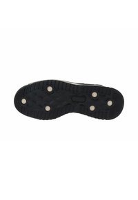 Suola di scarpa in gomma nera con superficie texturizzata, caratterizzata da borchie bianche e un bordo rialzato. Design sagomato per presa e stabilità.