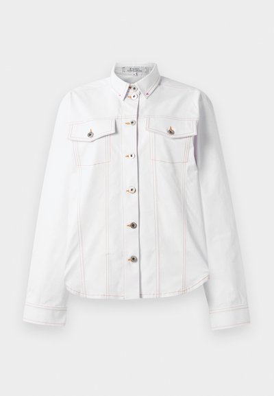 White shirt with long sleeves, collar, two chest pockets, orange stitching, and silver buttons. Clean design with a tailored fit.