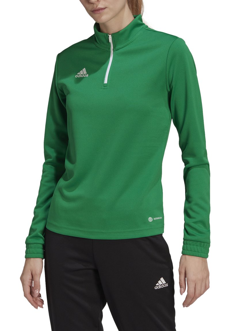 Groene, lange mouwen sporttop met een kwart rits en een hoge kraag. Bevat het Adidas-logo in het wit. Gemaakt van soepel, rekbaar materiaal.