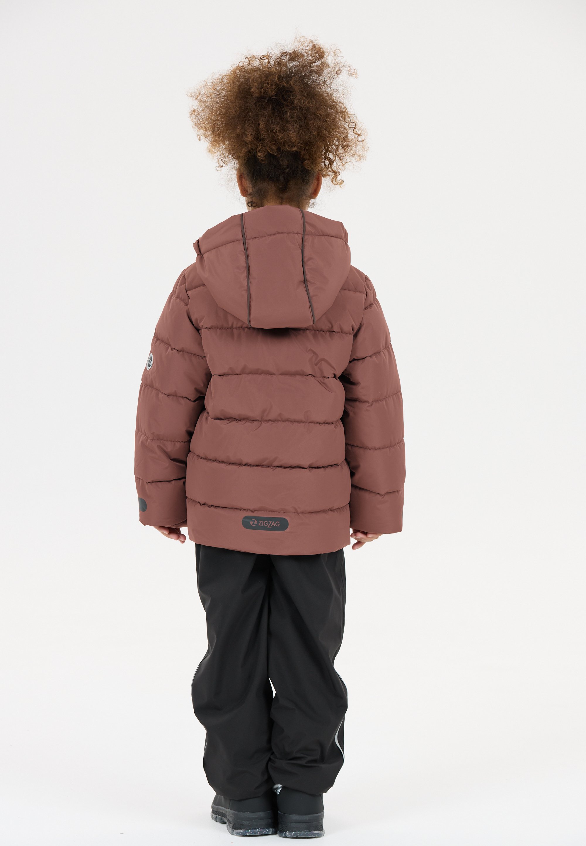 Brown padded jacket with a hood, featuring horizontal seams. Paired with black trousers and black boots. Minimalistic design, no visible patterns.