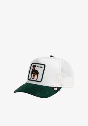 Gorra de béisbol blanca y verde con parte trasera de malla y parche que muestra un perro negro y marrón y las palabras "BAD BOY".