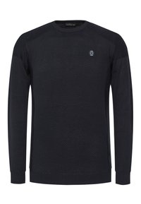 Pull en maille noire avec un motif texturé, col rond, manches longues et poignets côtelés. Comprend un petit écusson logo sur la poitrine.