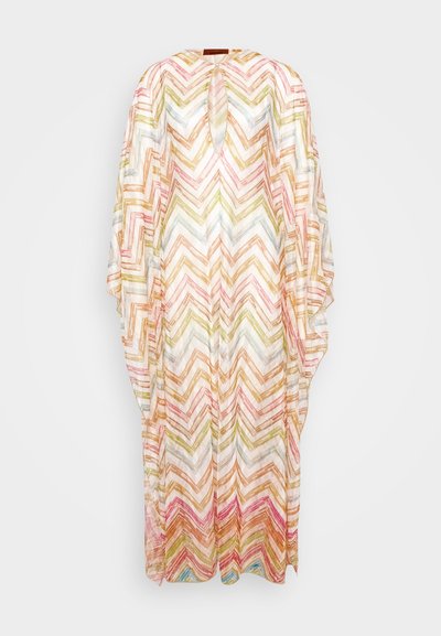 Dlhý kaftan z ľahkej tkaniny s farebným vzorom chevron v ružovej, zelenej a zlatej farbe. Hlavový výstrih a voľné rukávy.