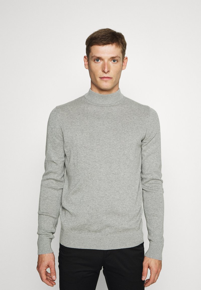 Gray sweater with a high neck, long sleeves, and ribbed cuffs, made from a soft material with a smooth texture. Plain design.