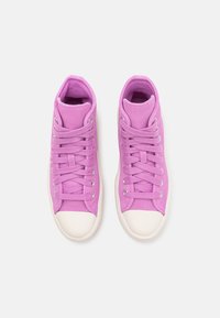 High-top sneakers in bright pink canvas with a white rubber toe cap and laces, featuring silver eyelets and soft interior lining.
