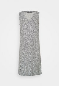 Vestido sin mangas con escote en V, hecho de tela ligera. Presenta un patrón floral en blanco y negro, de longitud hasta la rodilla, con un corte holgado.