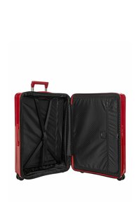 Valigia rigida rossa con finitura lucida, manico retrattile e interno nero dotato di cinghie e scomparti con zip.