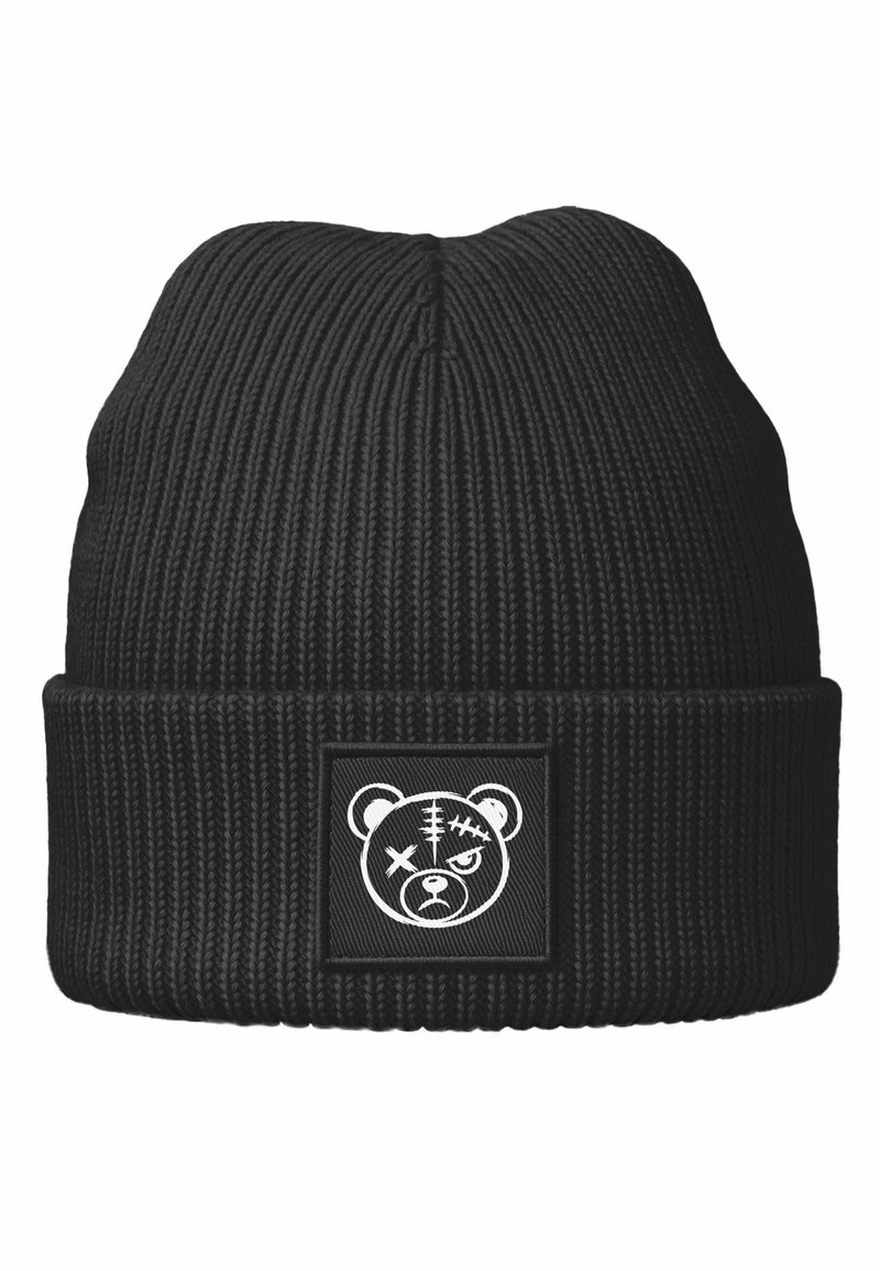 Black ribbed knit beanie with a folded cuff. Features a square patch with a white bear graphic, displaying stitches and expressive eyes.