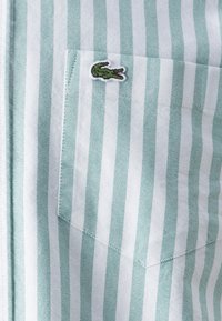 Lacoste Marškiniai - fluorine green/white