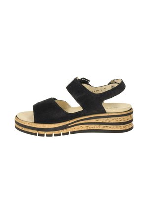 Schwarze Wildleder-Sandale mit offenem Zeh, Knöchelriemen, beiger gepolsterter Innensohle und einer mehrschichtigen Kork- und Gummiplattformsohle mit Profil.