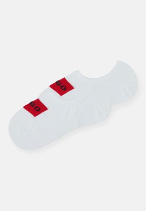 White ankle socks with red and black "GO" lettering on the cuff. Soft, stretchy fabric with a seamless toe design.