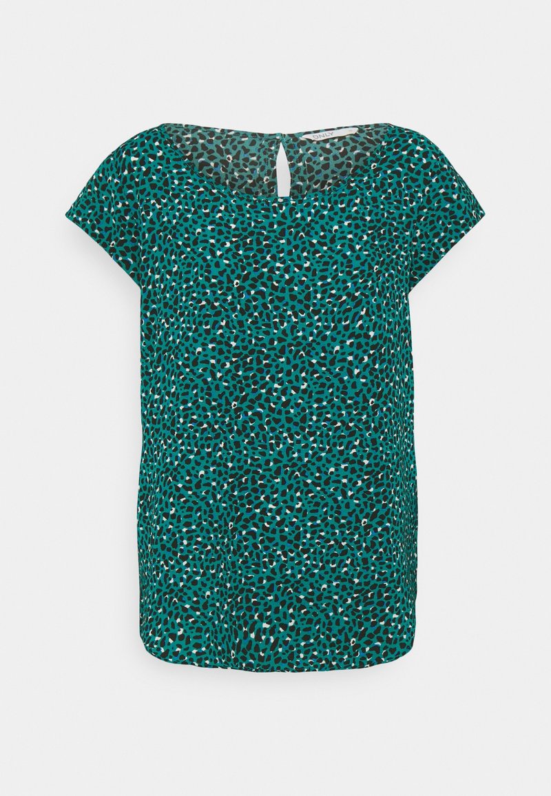 Tyrkysový top s krátkým rukávem a černým puntíkovaným vzorem, s kulatým výstřihem a detaily ve tvaru klíčové dírky na zádech. Měkká textilie.