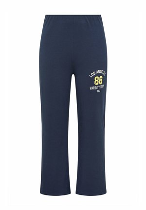 Donkerblauwe casual broek met elastische taille, brede pijpen en geel-witte opdruk op het bovenbeen met de tekst "Los Angeles 86 Varsity Team CALI."