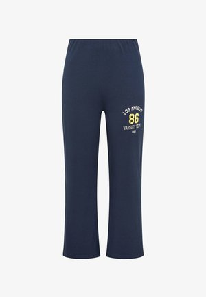 Pantalon décontracté bleu marine avec taille élastique, jambes larges, et impression jaune-blanche sur la cuisse indiquant « Los Angeles 86 Varsity Team CALI ».