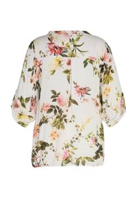 Blouse blanche avec imprimé floral rose et jaune, manches trois-quarts bouffantes et pli creux au dos.