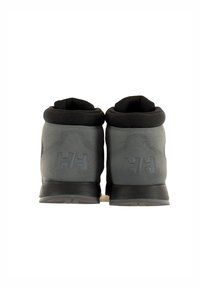 Grijze mid-top laarzen van een glad materiaal, met een zwarte gevoerde kraag en het gegraveerde HH-logo op de achterkant. Voorzien van een stevige zwarte rubberen zool.