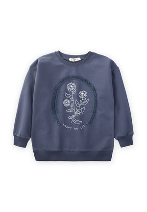 Felpa blu navy con un motivo floreale ricamato rotondo e bordo testurizzato. Presenta polsini e orlo con costine, realizzata in tessuto morbido.