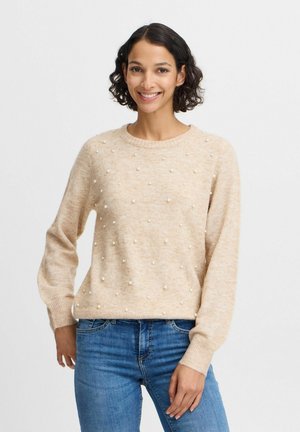 Beige gebreide trui met een ronde hals en een textuurdesign met kleine parelaccenten overal. Lange mouwen en geribde boorden.