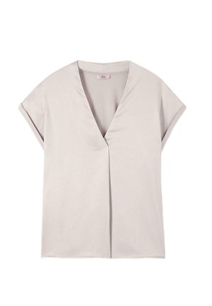 Bluză scurtă de culoare bej deschis, cu mâneci scurte, decolteu în V și design minimalist, așezată plat pe un fundal alb.
