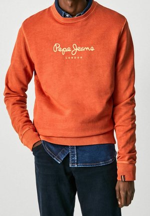Sudadera naranja hecha de tejido suave, con cuello redondo, puños de canalé y el logotipo "Pepe Jeans London" en color crema.