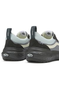 Men's sneaker with a grey and black color scheme, featuring a mesh upper, suede accents, and a textured black rubber sole.