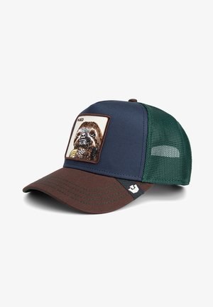 Trucker-Cap mit navy-vorderem Teil und brachialem Schirm. Mit einem Aufnäher eines Faultiers, grünen Netzseiten und einem Logo-Akzent an der Seite.