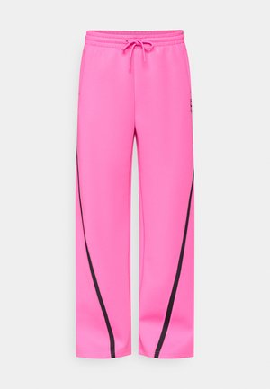 Pantaloni sportivi rosa con vita con coulisse, dettagli laterali neri a contrasto e vestibilità ampia con una texture liscia.
