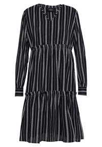 Vestido a rayas blanco y negro con mangas largas, escote en V, cintura fruncida y falda en capas. La tela tiene una textura ligera.