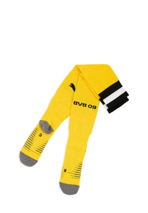 Gule fodboldsokker med sorte og hvide striber øverst, grå tæer og hæle, "BVB 09" og Puma-logo i sort på siderne.