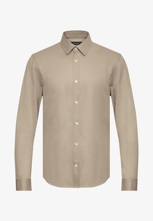 Beige színű, hosszú ujjú ing, hegyes gallérral, gombos elejével és puha textúrával. Fehér gombokkal és egyenesen vágott alsó résszel rendelkezik.