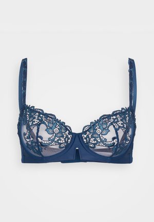 Námornícky modrá podprsenka s čipkovými detailami v teal farbe a kvetinovými vzormi. Priesvitné košíky, nastaviteľné ramienka a dekoratívny výrez v strede.