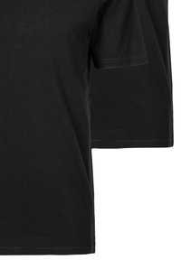 T-shirt noir à manches courtes en tissu coton, avec un col rond standard et une texture douce. Détails minimalistes, couleur unie.
