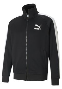 Giacca sportiva nera con zip e colletto alto, pannelli laterali bianchi e logo Puma. Presenta due tasche anteriori e polsini a coste. Tessuto morbido.