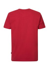 Red short-sleeve t-shirt made of cotton. Features a rounded neckline and a plain back with a small label on the side.