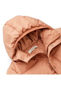 Padded jacket in soft peach fabric. Features a lined hood, zipper closure, snap buttons, and an inner label with “LIEWOOD.” Smooth texture.