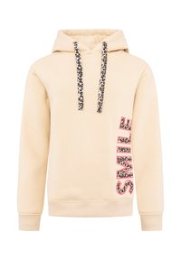 Sudadera beige con cordones de estampado de leopardo, que presenta un audaz "SONRÍE" en rosa y estampado animal a lo largo del costado. Diseño suave y casual.