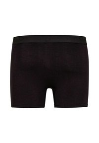 Schwarze Boxershorts aus einem glatten Stoff, mit einem einfarbigen schwarzen Bund. Das Design ist figurbetont und hat eine Länge bis zur Mitte des Oberschenkels.