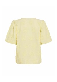 Blouse jaune clair à manches courtes avec application florale texturée et manches bouffantes, vue de dos.