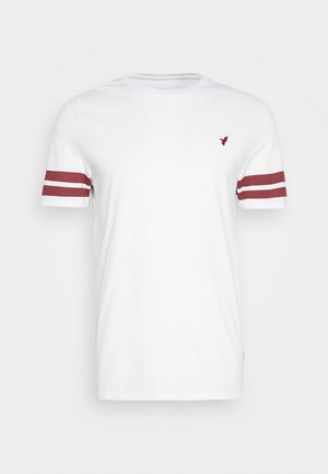 White cotton t-shirt with a crew neck, featuring maroon stripes on the sleeves and a small logo on the chest. Smooth texture.